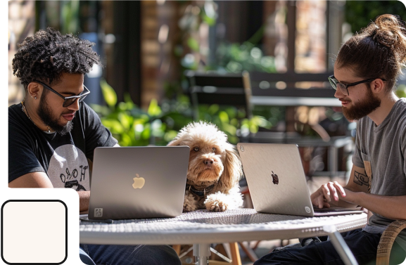 Developer working infront of a computer wearing headphones.